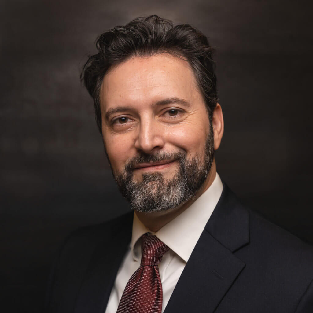 Headshot of Amplify's Director of Investments and Trading Claudiu Barbos.